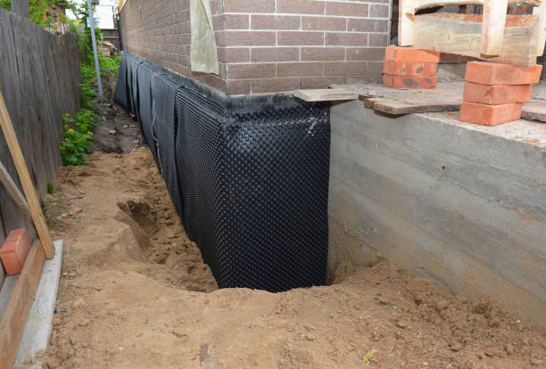 Happy homeowners after waterproofing job in Glenside
